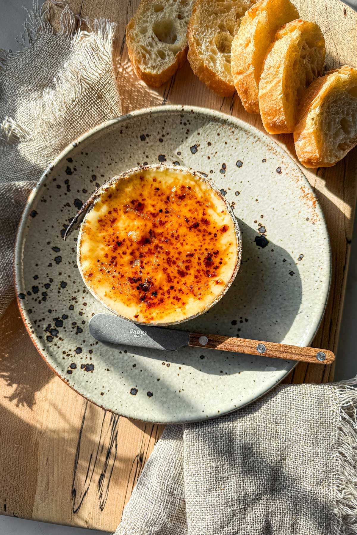 Maple brûlée Harbison recipe with molten Vermont cheese and caramelized maple sugar crust