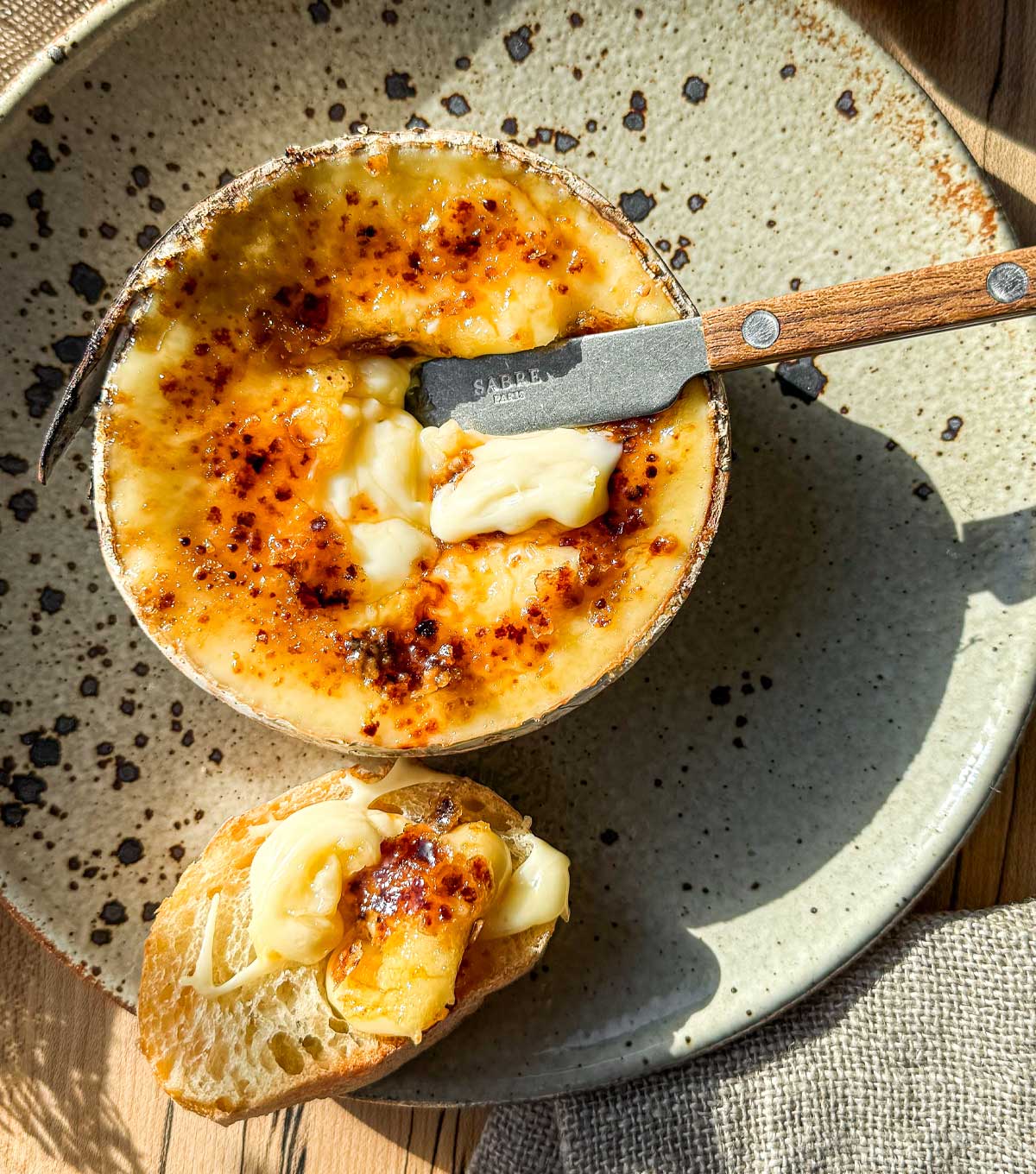 Maple brûlée Harbison recipe with molten Vermont cheese and caramelized maple sugar crust