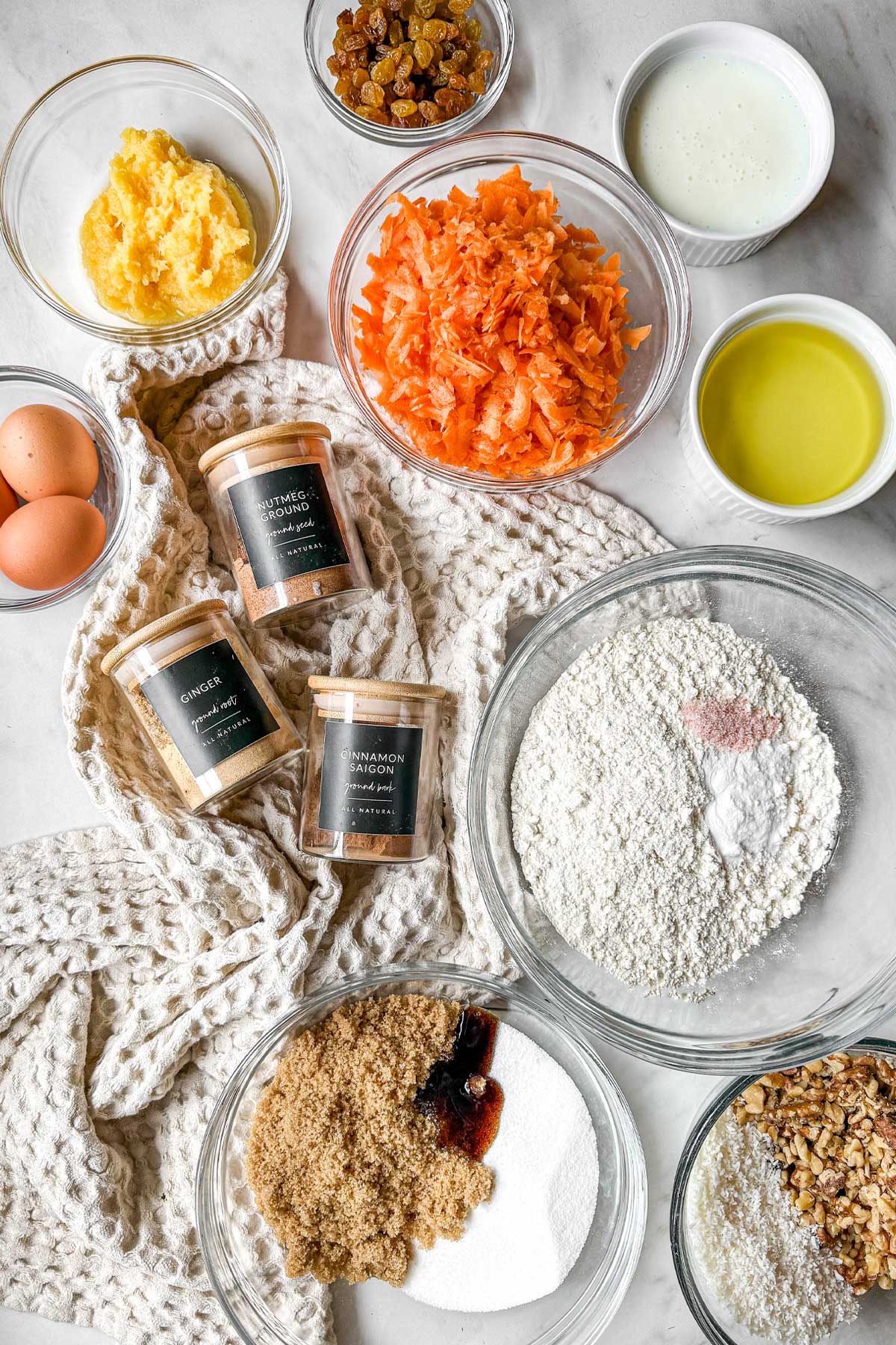 Ingredients for Carrot Cake with pineapple, coconut, raisins, and walnuts
